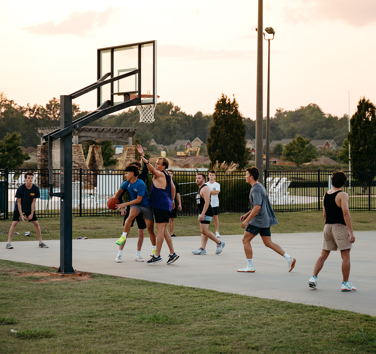 group of young men playing basketball